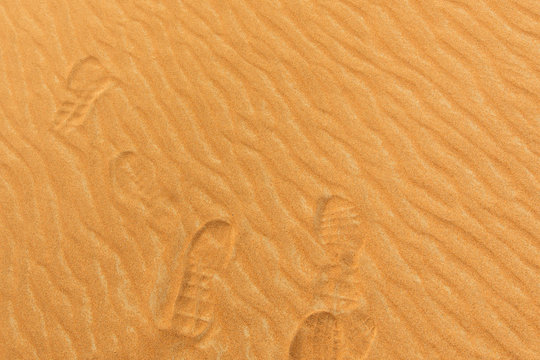 Photo of footprints on the sand of a desert in the United Arab E