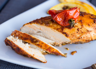 incision baked chicken in a spicy curry sauce with vegetables