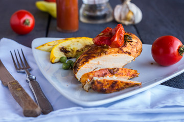 the cut chicken fillet baked in spices and tomato sauce