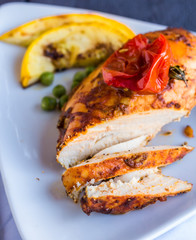 the cut chicken fillet baked in spices and tomato sauce