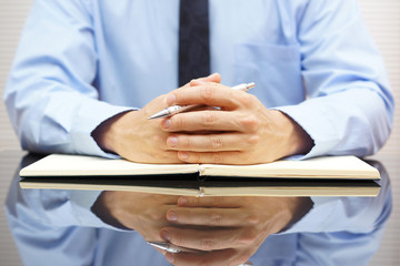 businessman sitting at his office and interrogated his client