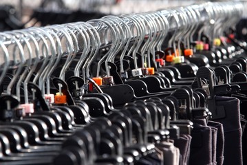 Fototapeta premium clothes hangers and clothes for sale at the market