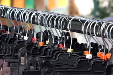 Fototapeta premium Many clothes hangers and clothes shopping centre for sale