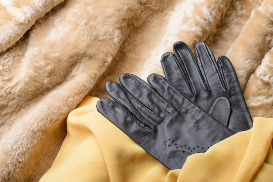 Warm blond sheepskin with black leather gloves and yellow silk scarf