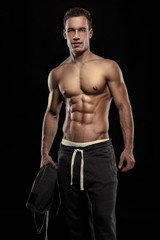 Fototapeta na wymiar Strong Athletic Man Fitness Model Torso showing muscular body