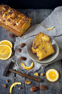 two slices of citrus cake with hammer and orange slices