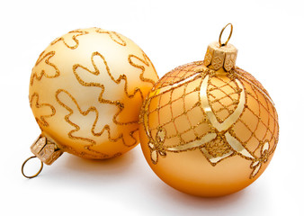Two golden christmas balls isolated - Powered by Adobe