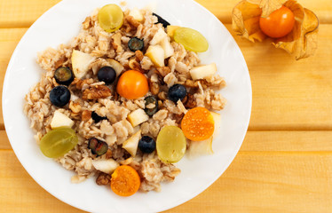 oat muesli with physalis, blueberry and grape