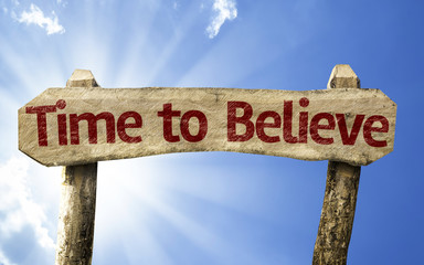Time to Believe wooden sign on a beautiful day