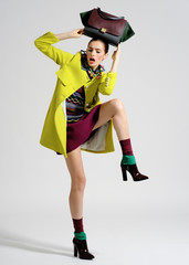 Fashion model pose on light background