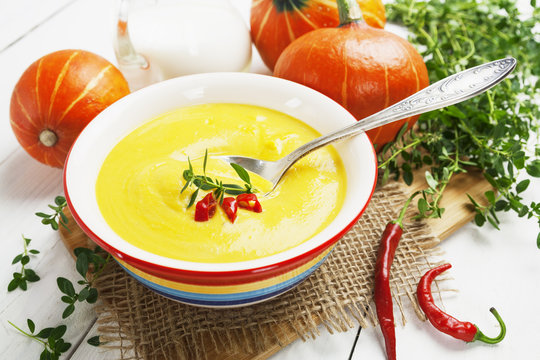 Spicy pumpkin soup with cream and chili pepper