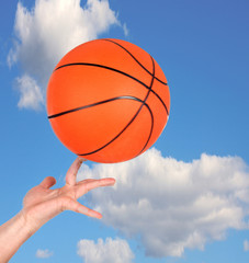 Hand holding a basketball
