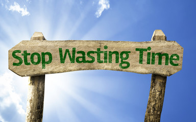 Stop Wasting Time wooden sign on a beautiful day - obrazy, fototapety, plakaty
