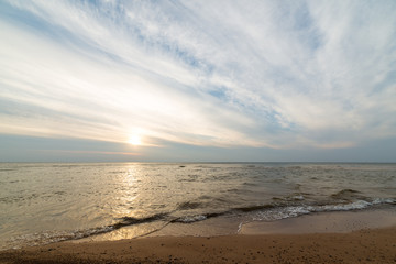Fototapeta na wymiar Shoreline of Baltic sea beach with rocks and sand dunes