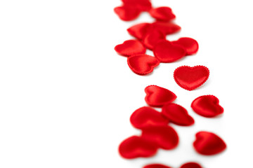 Fototapeta na wymiar Felt red hearts isolated on a white background