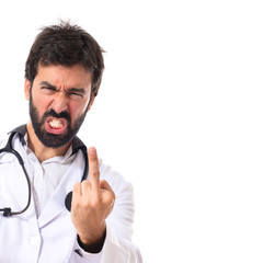 Doctor making horn gesture over white background