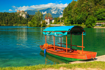 Castle and traditional wooden boat on Lake Bled,Slovenia,Europe