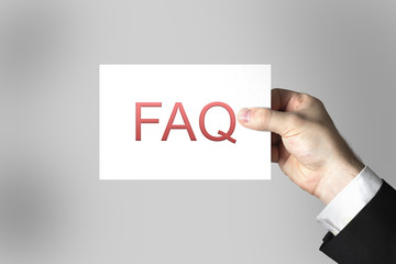 hand showing sign faq frequently asked questions