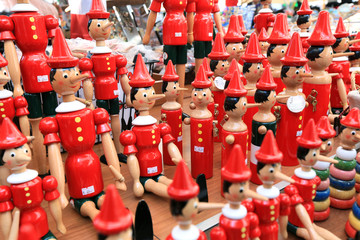 Painted wooden souvenir dolls of the figure of Pinocchio