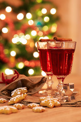 Two glasses of mulled wine with gingerbread and spices