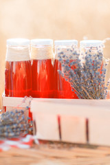 Juice, berries and lavender in a straw basket.