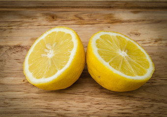 yellow lemon on wood background
