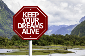 Keep Your Dreams Alive written on red road sign