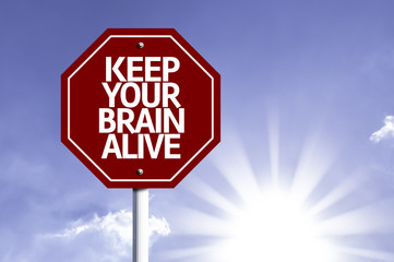 Keep Your Brain Alive written on red road sign