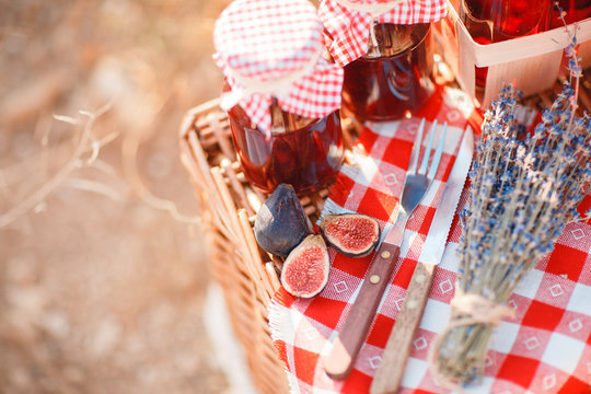 Juice, berries and lavender in a straw basket.