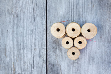 Vintage spools of thread on a wooden table