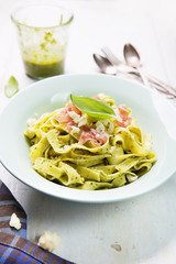 Pasta with pesto and prosciutto ham