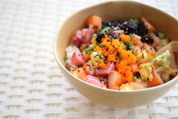 Sushi don , raw salmon tuna octopus on rice