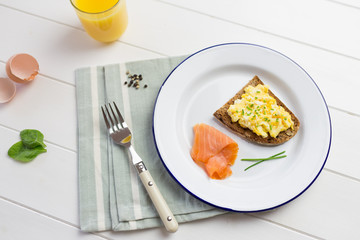 Top view of high protein breakfast with eggs and salmon