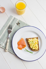 Top view of high protein breakfast with eggs and salmon