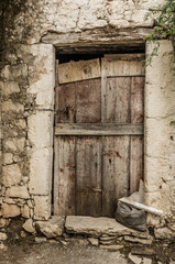 Fototapeta na wymiar Old timber door in the scuffed wall