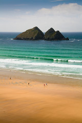 Fototapeta premium People on the beach in Holywell Bay, Cornwall, UK.