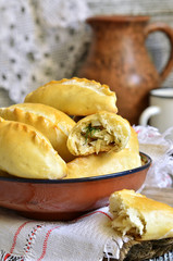 Baked patties with cabbage and dill.