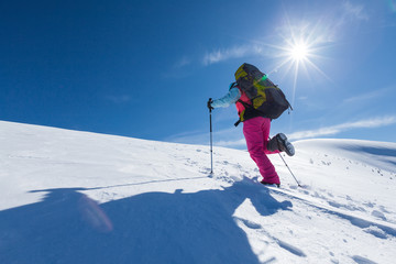 Fototapeta na wymiar Hiker in winter mountains on sunny day