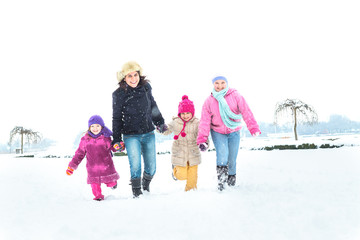 Happy family enjoying in winter