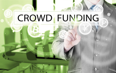 Businessman pushes virtual crowd funding button