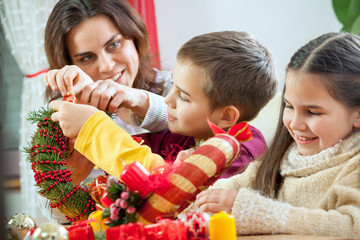 Happy young family getting ready for the Advent, Christmas holid