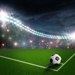 Fototapeta na wymiar soccer ball on the green field corner