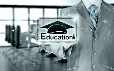 Obraz premium business man pointing 'education' concept