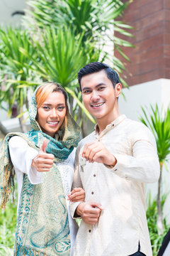 Asian Muslim Couple Moving Into House