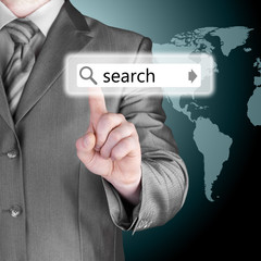 Businessman pushing virtual search bar