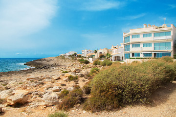 Fototapeta premium Portrait of tropical apartment building on the beach.