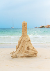 Fototapeta na wymiar Tower from sand on the beach.