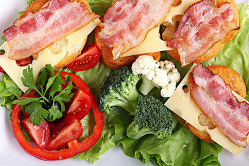 Serving breakfast toast with bacon and herbs