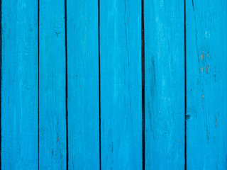 Wooden fence blue background