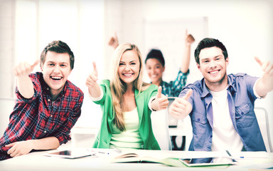 students showing thumbs up at school